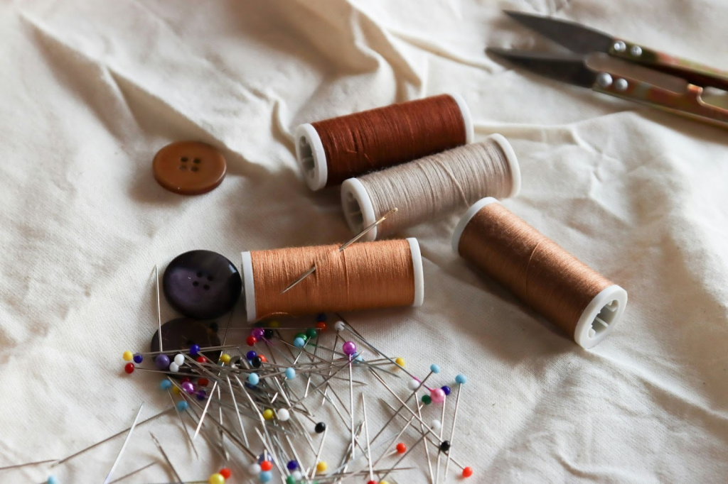thread, pins and tools you'll need for upcycling old clothes